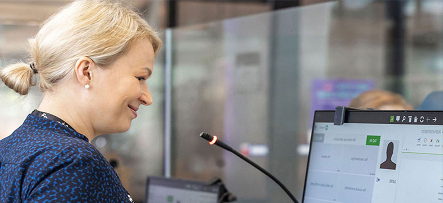woman working on computer at reception